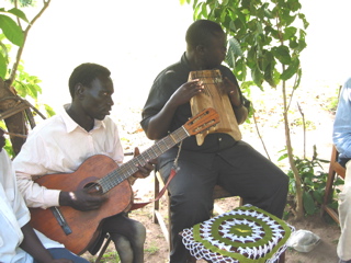 Our Ugandan friends sing for us.