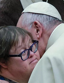 Pope Francis blesses the sick and disabled at the Paul VI Hall in Vatican City.
