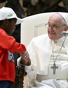 Pope Francis shakes hands with one boy of 7000 gathered from around the world in St. Peters Square.